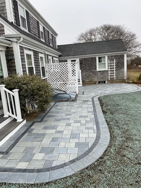 Block retaining wall beside a farmers porch