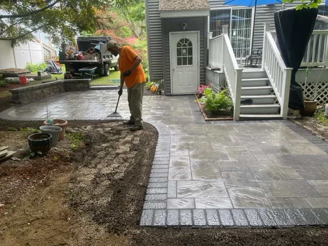 Sweeping polymeric sand into a new paver walkway