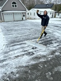 Clearing snow from a driveway in Central Massachusetts