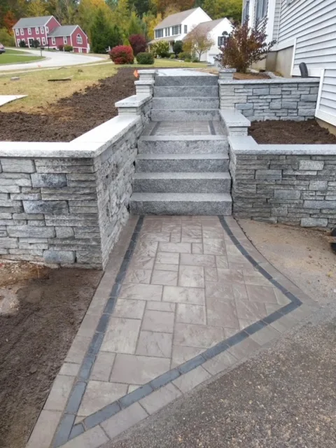 Stone stairs and retaining wall with paver walkway
